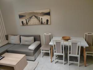 a living room with a couch and a table at Bonaca in Igalo