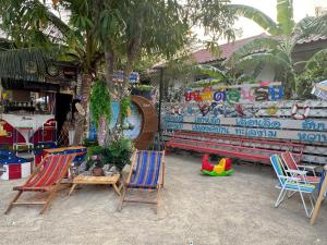 a group of chairs sitting in front of a store at OYO 75539 Phanthida Resort and Cafe in Hua Hin