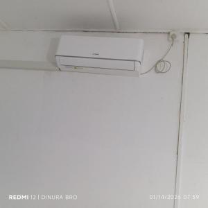a projector on a ceiling in a room at Cattleya Guest House in Tissamaharama