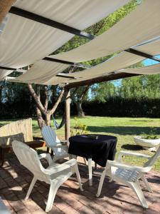 a table and two chairs under a tent at Apartamento Cerrito in San Rafael