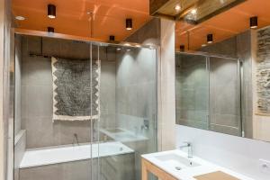 a bathroom with a shower and a sink at La Maison Brevan in Châteaulin