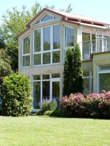 a large house with large windows at Am Langenwerder Whg 4 in Gollwitz