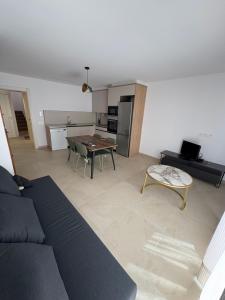 a living room with a couch and a table at Casa Brillantes Completa in Ayerbe