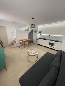 a living room with a couch and a table at Casa Brillantes Completa in Ayerbe +27 photos