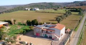 an aerial view of a house in a field at Casalebellavista in Tarquinia