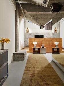 a living room with two tables and a rug at Ottilia Heritage in Copenhagen