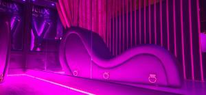 a pink room with a large letter m in it at VILLA CLOSE BRIVE centre - LOVE ROOM - SPA privatif in Brive-la-Gaillarde