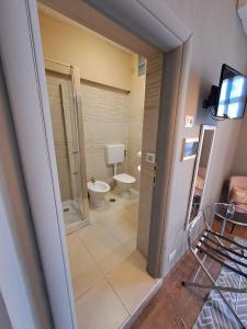 a bathroom with a toilet and a walk in shower at Il Roseto in Frosinone +78 photos