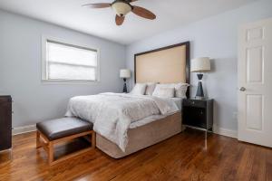 a bedroom with a bed and a ceiling fan at 5 Woods Dr in Mechanicsburg