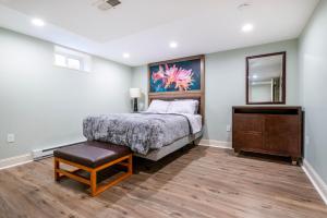 a bedroom with a bed and a dresser and a mirror at 5 Woods Dr in Mechanicsburg