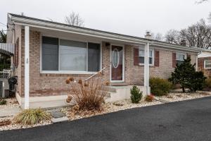a brick house with a window and a driveway at 5 Woods Dr in Mechanicsburg +35 photos