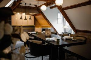 a dining room with a long table and chairs at MEWS House Zürich in Zurich +39 photos