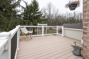 a porch with a white fence and a chair at 5 Woods Dr in Mechanicsburg