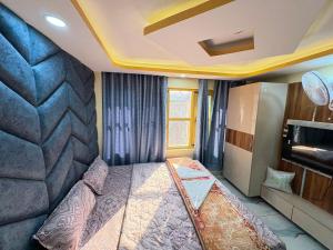 a bedroom with a large bed in a room at Hotel Sahil - City Center, LalChowk in Srinagar +62 photos