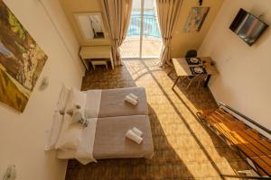 an overhead view of a living room with a couch at Ilios Mare Hotel in Agia Marina Nea Kydonias