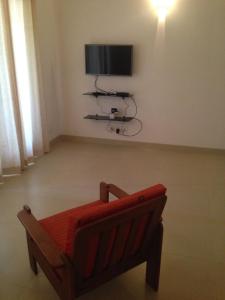 TV a/nebo společenská místnost v ubytování Studio and One bedroom Apartment in Riviera Sapphire, Siolim