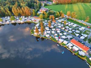 an aerial view of a parking lot next to a lake at Seechalet Kranich in Roding