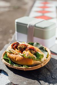 a sandwich in a basket on a table at Vuluq in Shoufeng