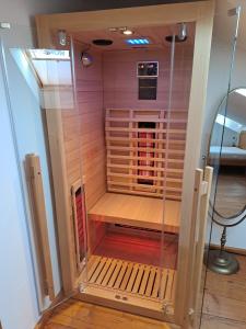 a sauna with a glass door in a room at Kaffeehaus Blaslhöhe in Lam +138 photos