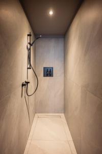 a bathroom with a shower in a wall at Boutique Casa Giulietta Luxury in Como +44 photos