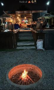 a fire pit in the ground at night at El Rincon Secreto in Quillota