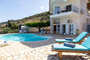 a villa with a swimming pool and a house at InstaView Tolo 2 in Tolo