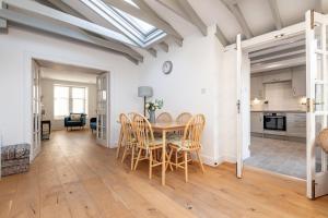 a kitchen and dining room with a table and chairs at School Wynd No 6 - Elie in Elie +18 photos
