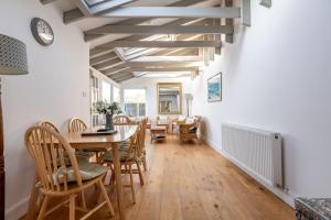 a dining room with a table and chairs at School Wynd No 6 - Elie in Elie