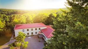an aerial view of a house with a red roof at Haus im Herrengrund in Schollbrunn