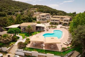 an aerial view of a resort with a swimming pool at Anemolia Parga Suites in Sarakiniko