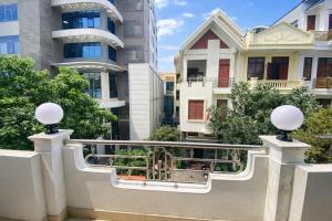 a balcony in a city with houses at Anh Đào 2 Hotel in Hai Phong