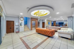 a living room with two couches and a couch at Cleopatra Ada Apart & Suites Hotel in Alanya +21 photos
