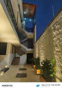 a view of a building with stairs and plants at Departamento Nuevo Suite Máster in Aguascalientes