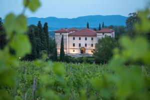 a large building in the middle of a field at PREMIUM B&B Nova Gorica, Self Check-In with code access in Nova Gorica