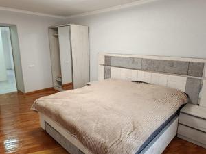 a bedroom with a large bed in a room at Jermuk Calm House in Jermuk