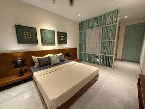 a bedroom with a large bed in a room at Hansa Villa in Weligama +9 photos
