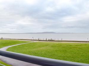 a view of the beach from a car window at Gower Sunset Views in Llanelli