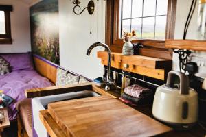 a kitchen counter with a sink and a sink at Finest Retreats - Weardale Shepherds Hut in Bishop Auckland