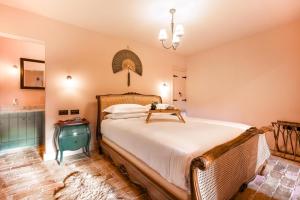 a bedroom with a bed with a table on it at 3 Bed in Ringsfield oc-m33329 in Wingfield +36 photos