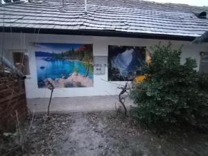 a building with paintings on the side of it at InterSoul Apartman in Gyöngyös
