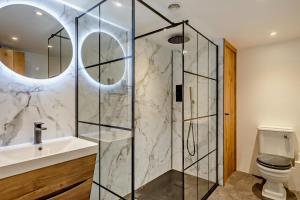 a bathroom with a shower and a sink and a toilet at 3 Bed in Croyde oc-s27761 in Croyde +18 photos