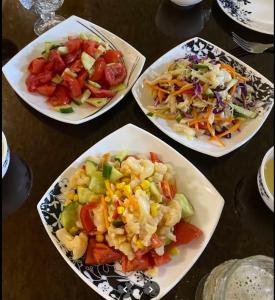 a group of plates of food on a table at Aydarkul Beach in Taldy