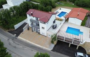 an overhead view of a house with a swimming pool at Villa Lux with swimming pool in Baška