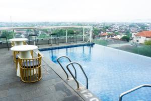 a large swimming pool on top of a building at Azana Style Hotel Tulungagung in Tulungagung