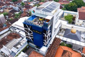 an overhead view of a building with a satellite at Azana Style Hotel Tulungagung in Tulungagung