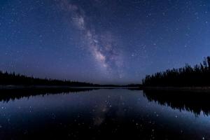 a night view of the milky way over a lake at MJ paddy view Homestay in Kumarakom