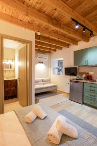 a kitchen with a large bed in a room at Pavliani Aesthesis by Raise in Pavliani
