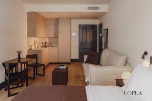 a living room with a couch and a table at Copla Bilbao in Bilbao