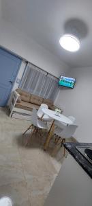 a living room with a couch and a table and chairs at San bernardo ll in San Bernardo