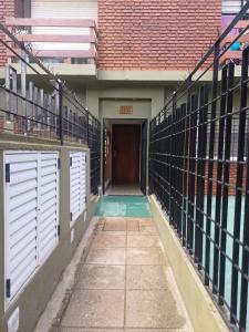 an empty hallway of a building with white doors at San bernardo ll in San Bernardo +3 photos